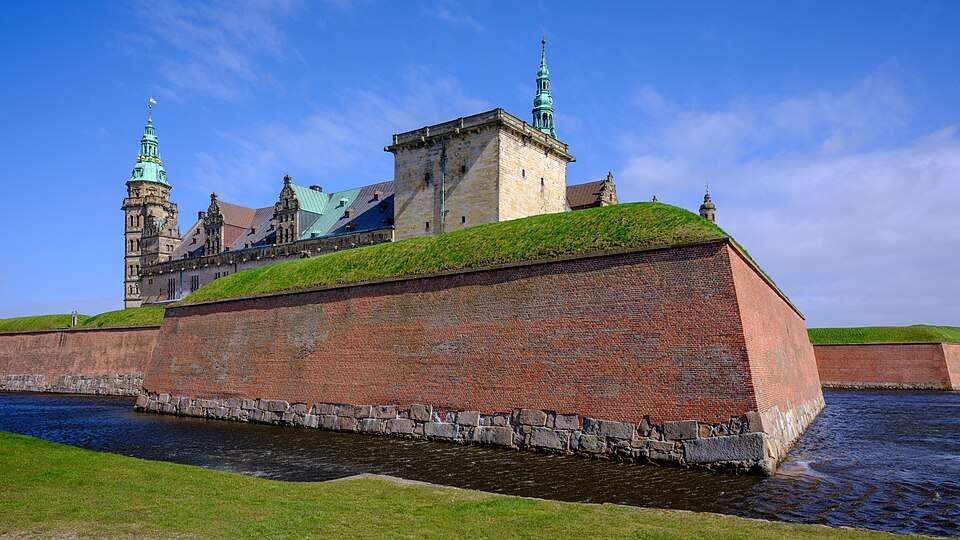 Kronborg Castle behind its ramparts and moat