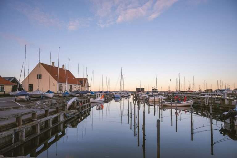 Boats moored in Dragør's old harbor at dusk