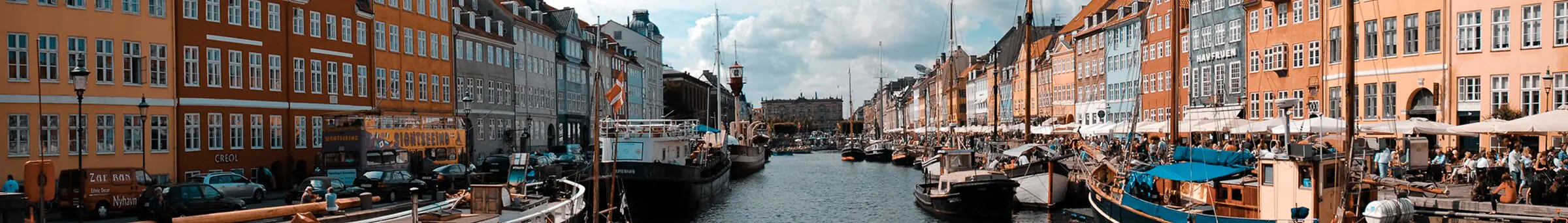 The colorful houses and boats along the Nyhavn canal in Copenhagen
